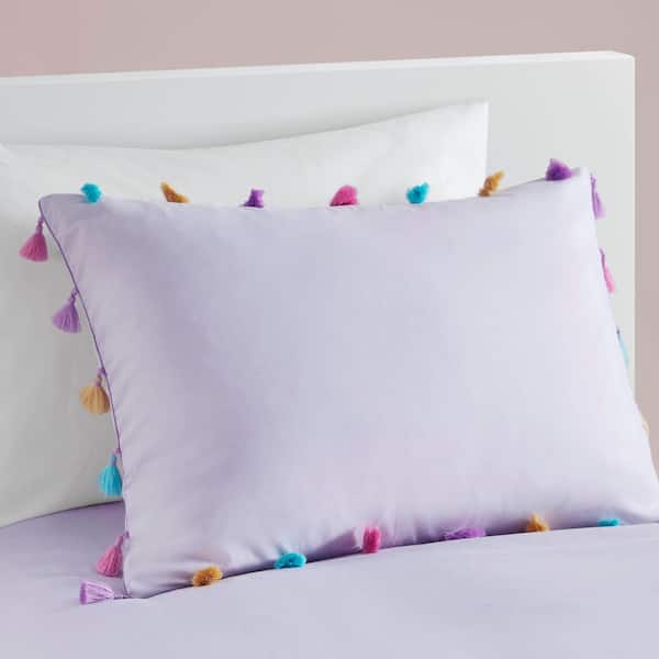 Wool dryer balls on top of folded linens.