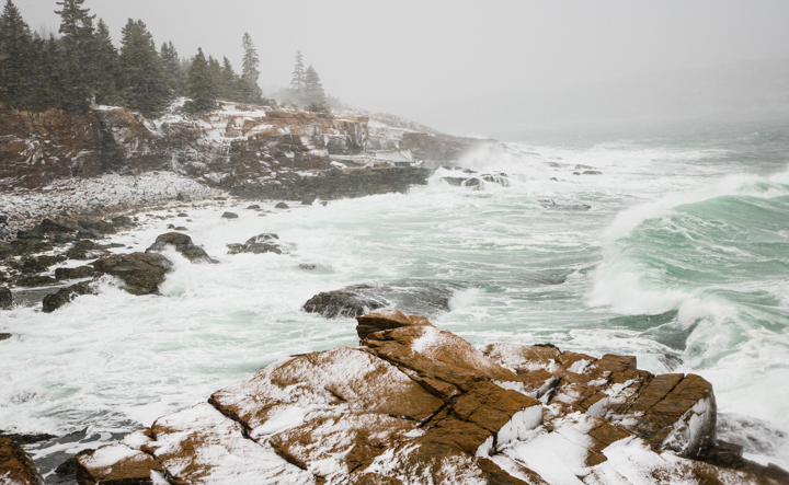 Bass Harbor Head Light, Acadia National Park, Maine in winter. The light is partially covered in snow.