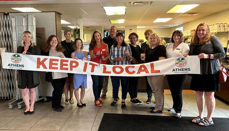 A barista pouring cold brew coffee