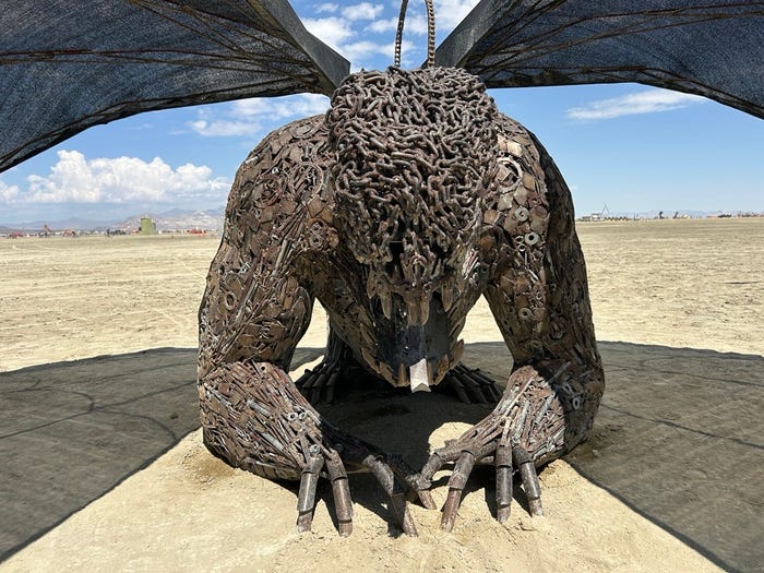 Candid street photography of market vendors in Marrakech juxtaposed with the warm, inviting glow of a cooking class in a Berber tent at sunset. Capture the textures of spices and the steaming tagine.