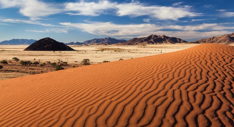 A landscape showcasing geological rock formations, emphasizing rock textures and colors that show the raw earth.