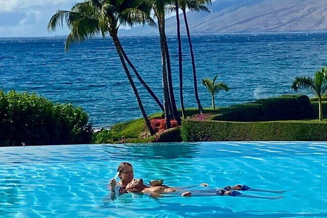 Woman receiving Watsu therapy in the ocean