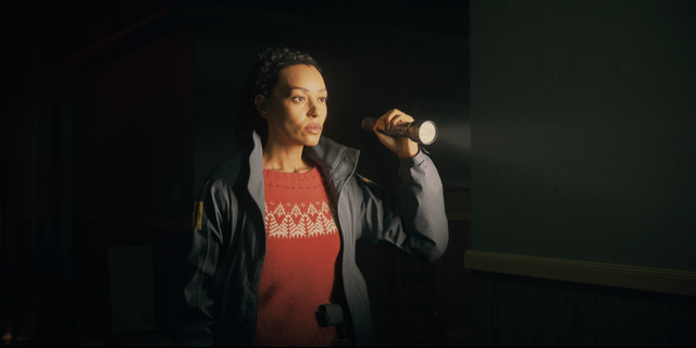 A close-up screenshot of Saga Anderson's Mind Place, with the Case Board prominently displayed. Clues are connected by threads, and profiling options are visible, showcasing the depth of the investigative mechanics. The lighting is moody and atmospheric.