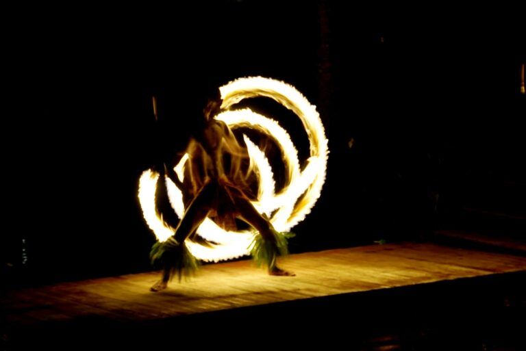Emily and Liam snorkeling in Muri Lagoon, surrounded by colorful fish