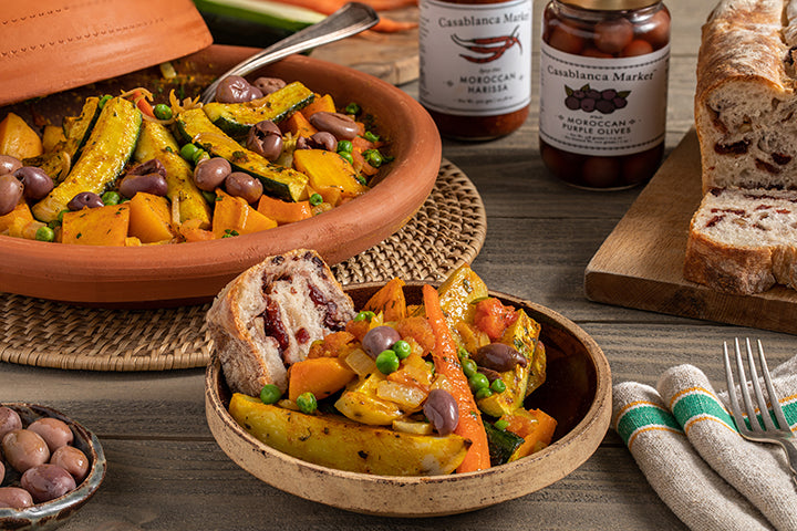 Berber family preparing tagine in the Atlas Mountains.