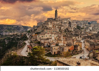 A wide-angle shot of the Sassi at sunset, capturing the golden light.