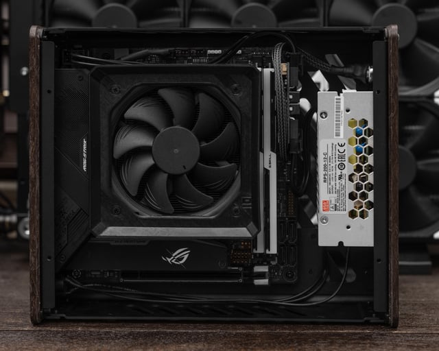 Image of the PC being transported in a custom carrying case with foam padding. The case should look durable and well-organized.