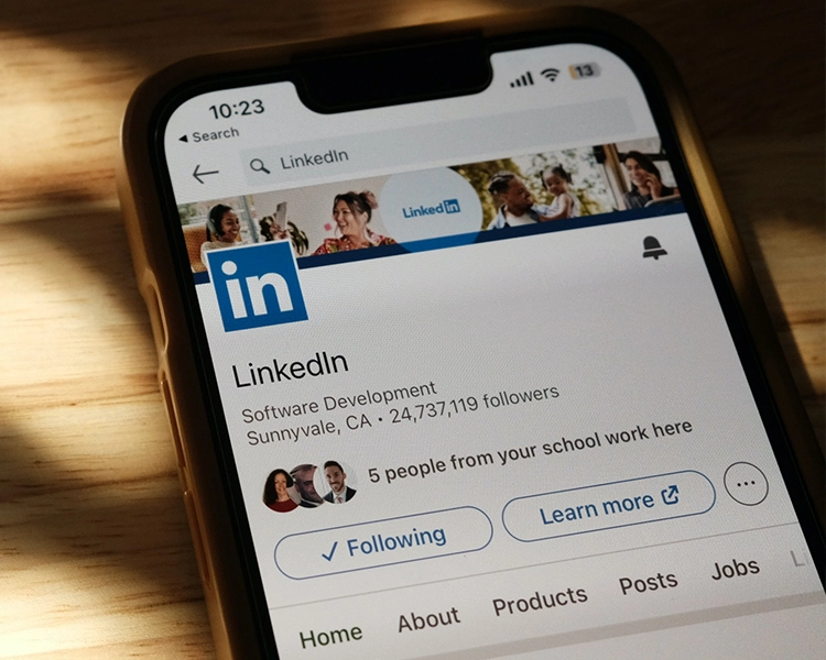 close up of LinkedIn feed on mobile with thought bubble in corner