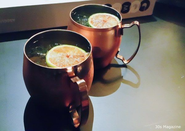 A close-up of the 'Dutch Mule' cocktail at the Pulitzer's Bar, highlighting the color and texture.