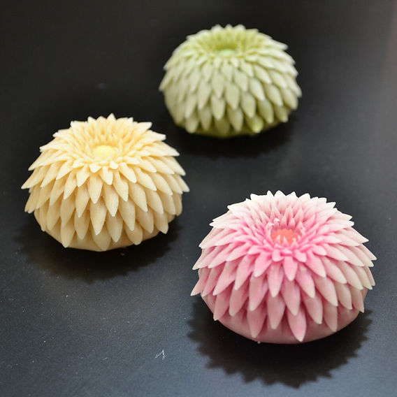 A beautifully presented slice of yokan, showcasing its smooth, dark surface and the delicate patterns within, emphasizing the art of presentation.