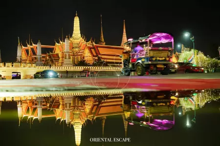 A vibrant night market scene in Chiang Mai, showcasing bustling stalls with colorful goods and street food vendors.