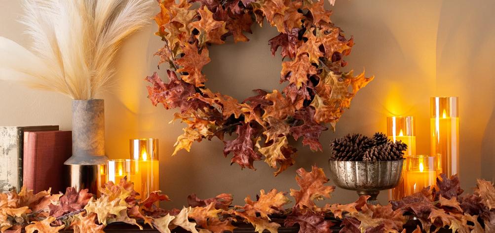 A close-up of a DIY fall wreath made with foraged grapevine, dried eucalyptus, and other natural elements