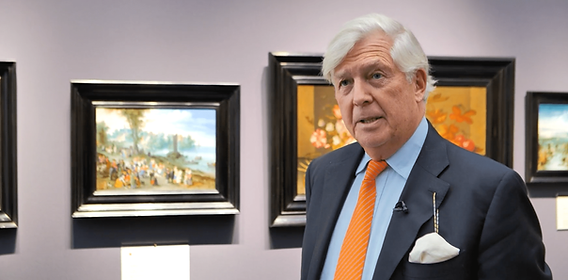 A cozy hotel room with art on the walls