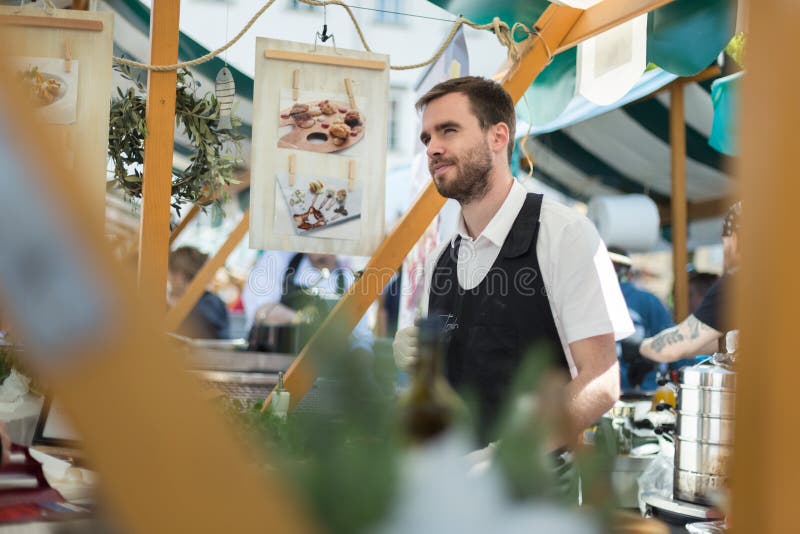 A vendor cooking food at Ljubljana Open Kitchen