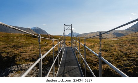 hiker crossing the bridge with a sense of awe and accomplishment