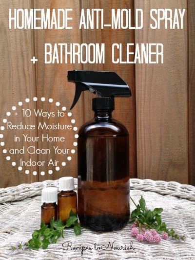 A set of cleaning cloths and a reusable spray bottle are on a wooden surface