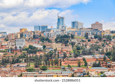 A majestic silverback gorilla sits amongst the lush greenery of Volcanoes National Park, radiating power and tranquility.