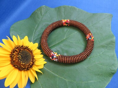Close-up photo of a black rhino being tracked by anti-poaching rangers, emphasizing the intensity and dedication of their work.