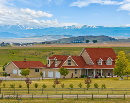 A picturesque rural landscape with a mountain backdrop