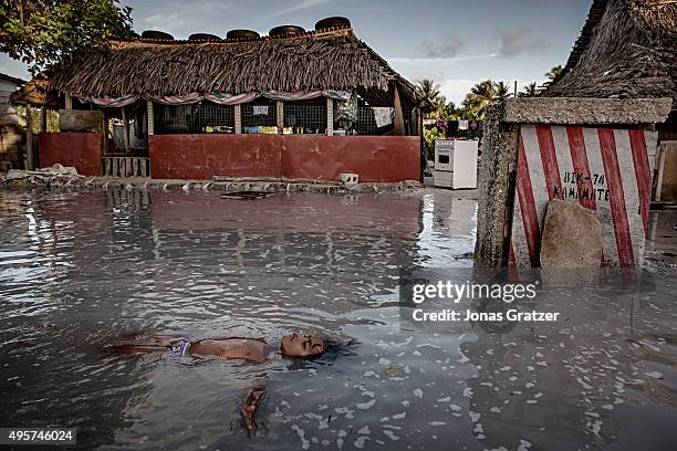 Dr. Sharma swimming in the vibrant lagoon of Kanton Island