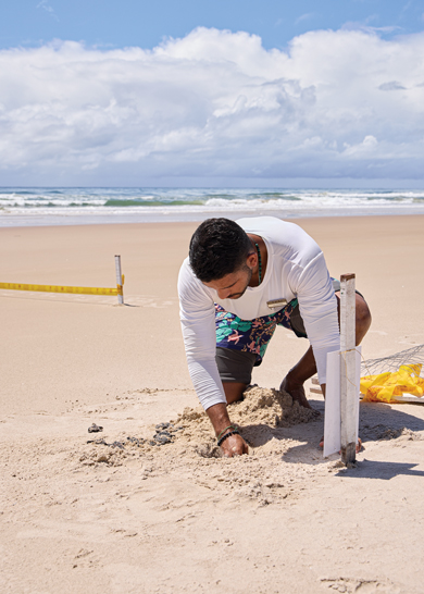 Anya foraging for plants in the rainforest.
