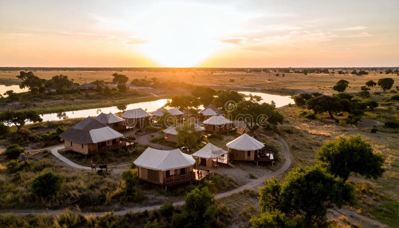 Aerial view of luxury safari camp at sunset in the Okavango Delta, Botswana