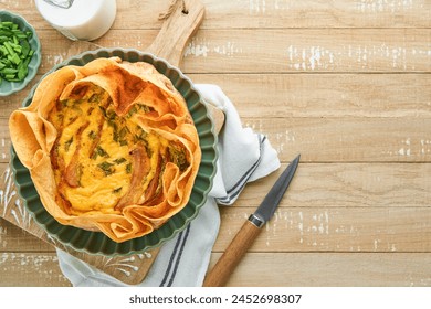 A beautifully plated slice of the Smoked Salmon and Asparagus Quiche with Wild Ramp Crust.