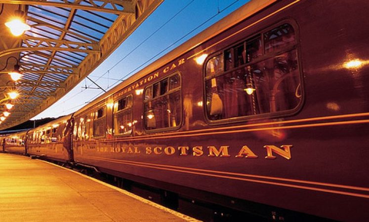 A panoramic view from the Highland Railway Retreat, showcasing the heather-covered moors and distant mountains