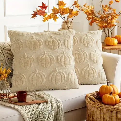 A rustic wooden tray filled with miniature pumpkins, pinecones, and candles, creating a charming autumn centerpiece.