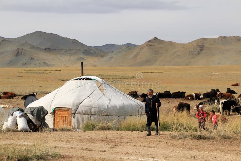 Wide-angle panoramic view of the Altai Mountains at golden hour, showcasing the scale and majesty of the landscape (shot with a polarizing filter to enhance color saturation).
