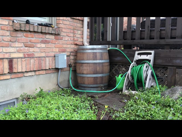 Diagram or hand-drawn illustration showing how a downspout diverter connects to the rain barrel.