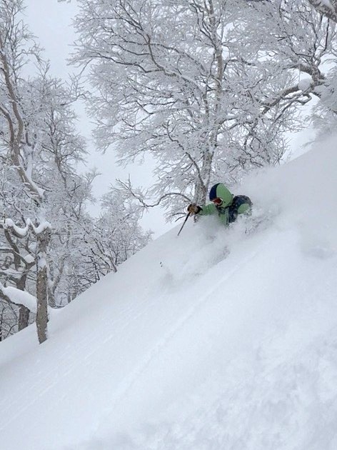 Snow rafting on the Sorachi River with snowy banks on either side