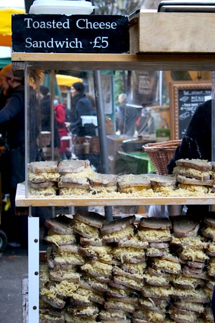 A vibrant shot of Borough Market, with cheese being grilled at Kappacasein