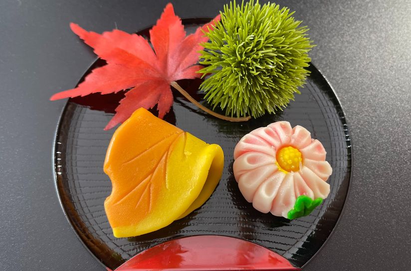 A glistening, perfectly charred piece of Galbi (Korean BBQ) is lifted slowly towards the microphone, the sizzle amplified.