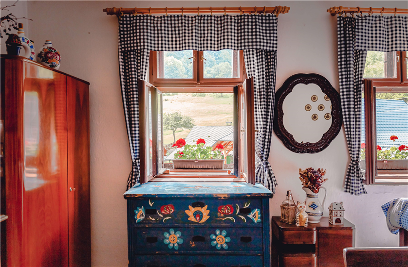 A personalized farmhouse living room with a mix of DIY and store-bought decor.