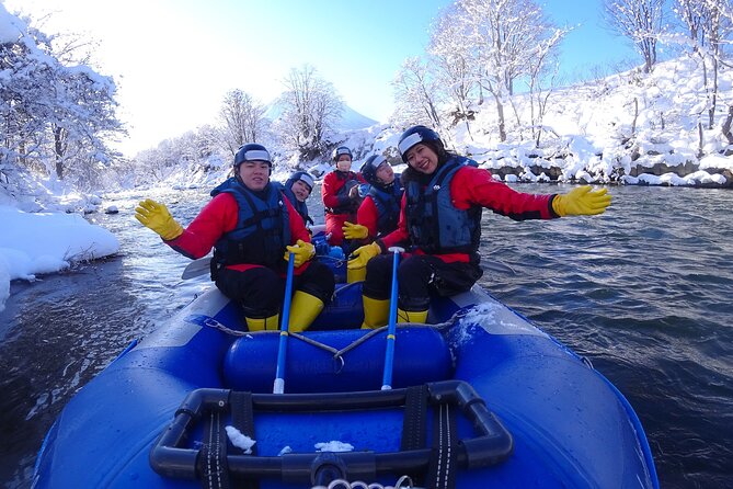 Snow Rafting in Furano with Daisetsuzan Mountain Range in Background