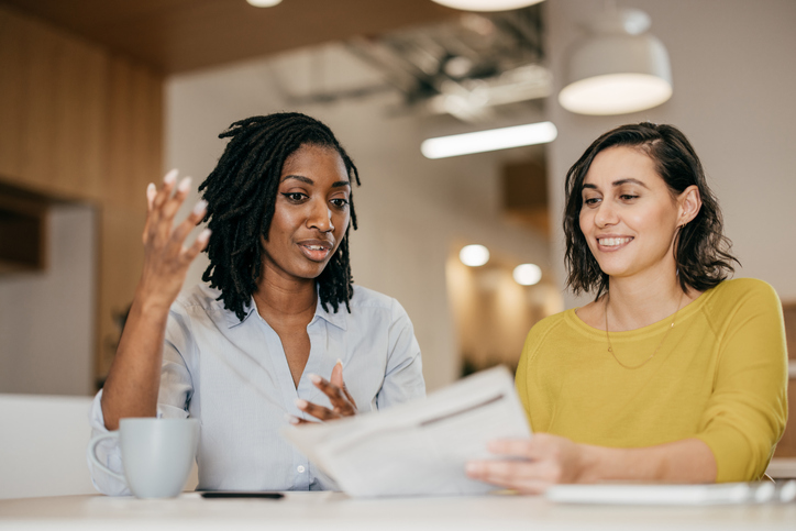 A bar graph showing the positive impact of a non-profit's work, with a diverse group of people celebrating in the background