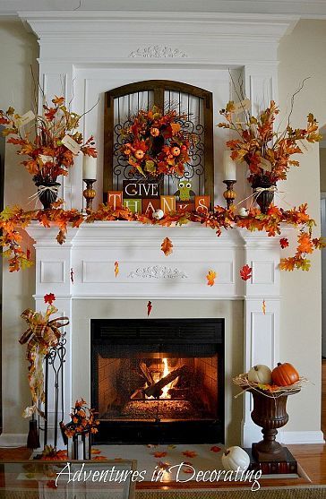 A living room featuring an orange throw blanket and pillows in warm autumn tones.