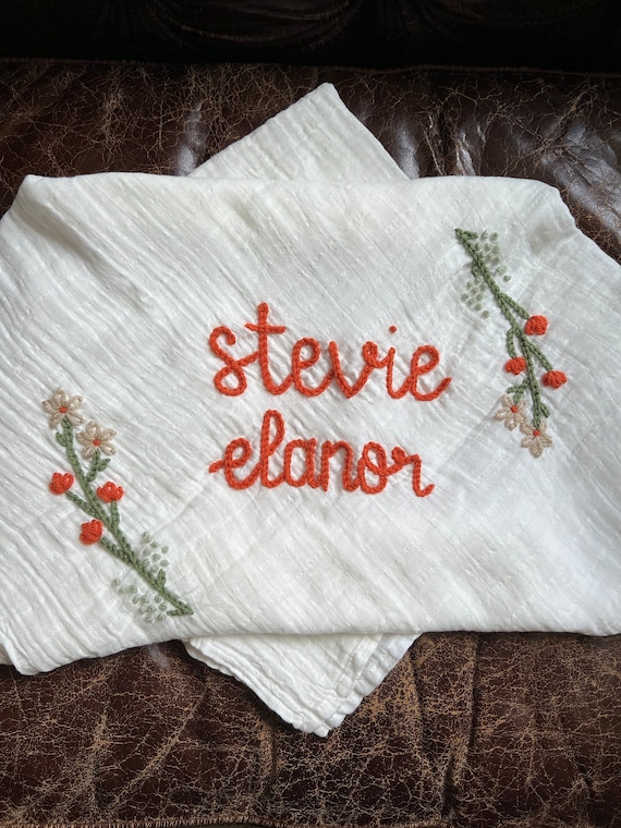 Close-up image demonstrating the cleaning process: blotting a stain with a soft cloth.
