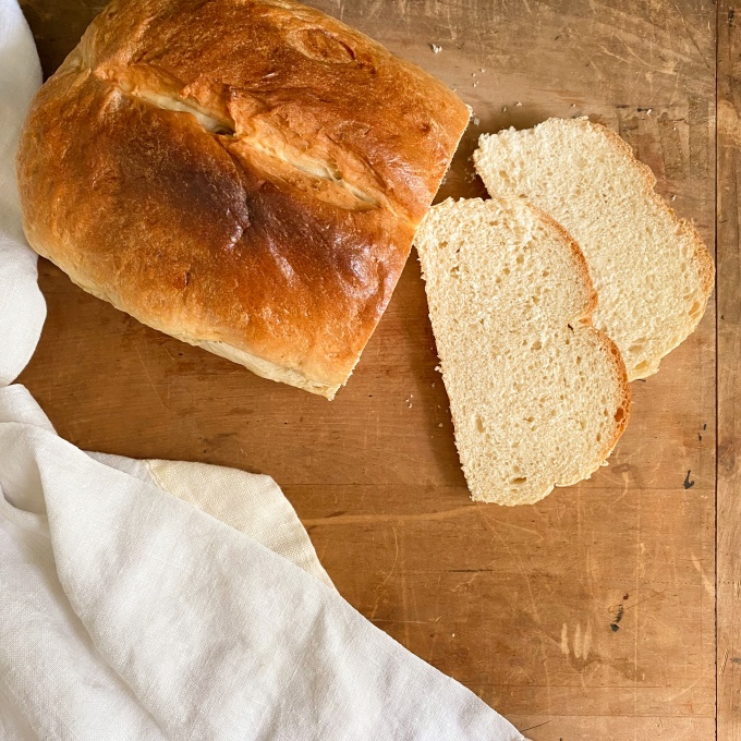 Image of several loaves of bread displayed on a table.