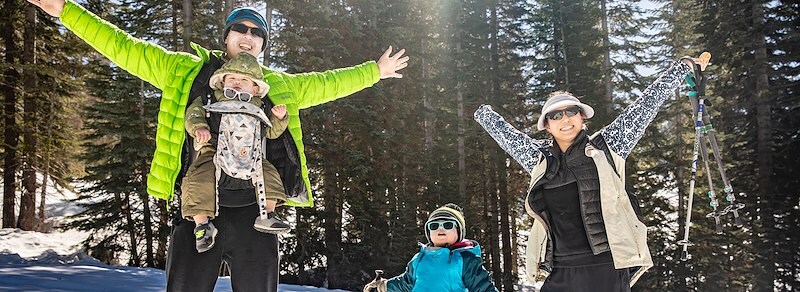 A scenic view of snowshoeing through a forest, showcasing the quiet beauty and solitude of nature.