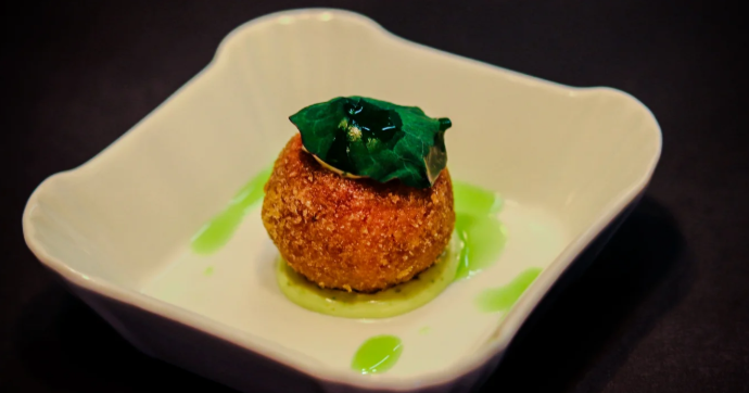 Benji foraging with the fisherman on the rocky coastline.