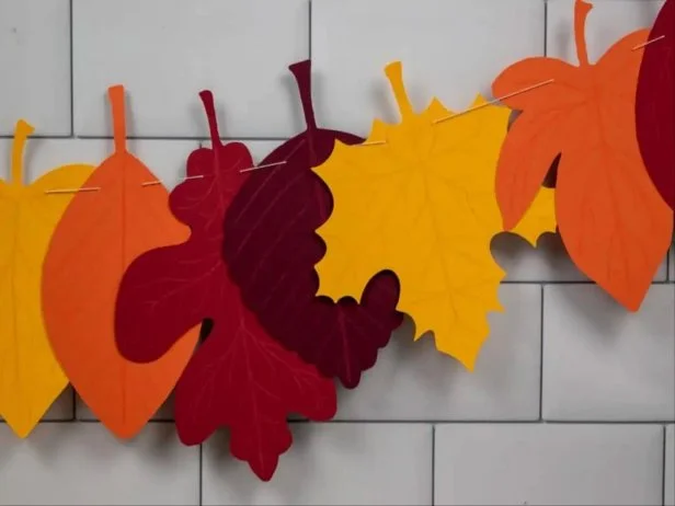 hands crafting garland table setting materials
