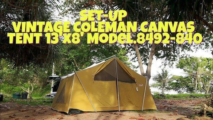 Javier attempting to assemble a dome tent with a complicated pole system, his face showing frustration and sweat.