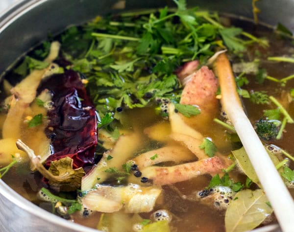 The Three Sisters Stew simmering gently in a cast iron pot, releasing its savory aromas.