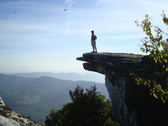 Hikers enjoying the view from McAfee Knob