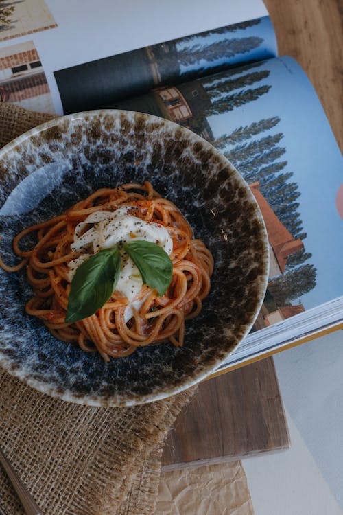 A bar setting with two people seated and talking