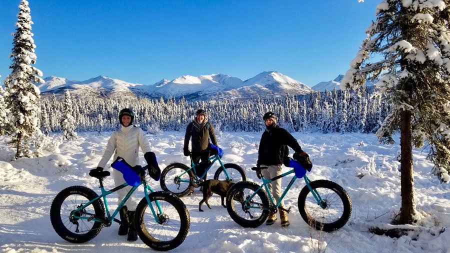 Wide shot of Flattop Mountain with fat bikers