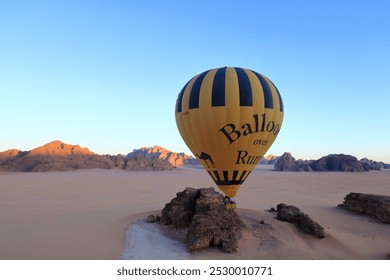 A quad bike kicking up sand against the backdrop of a shipwreck on the beach, highlighting the desolation and adventure.