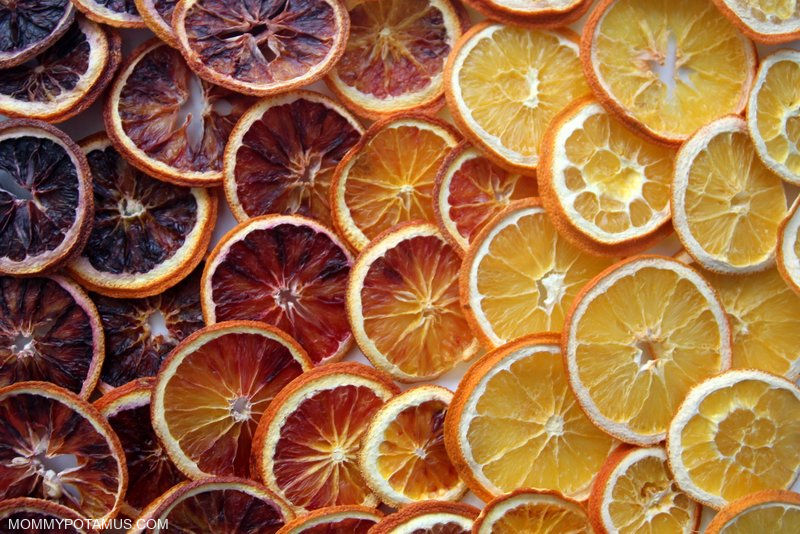 A close up shot of a finished dried orange garland, showcasing the different textures and elements.